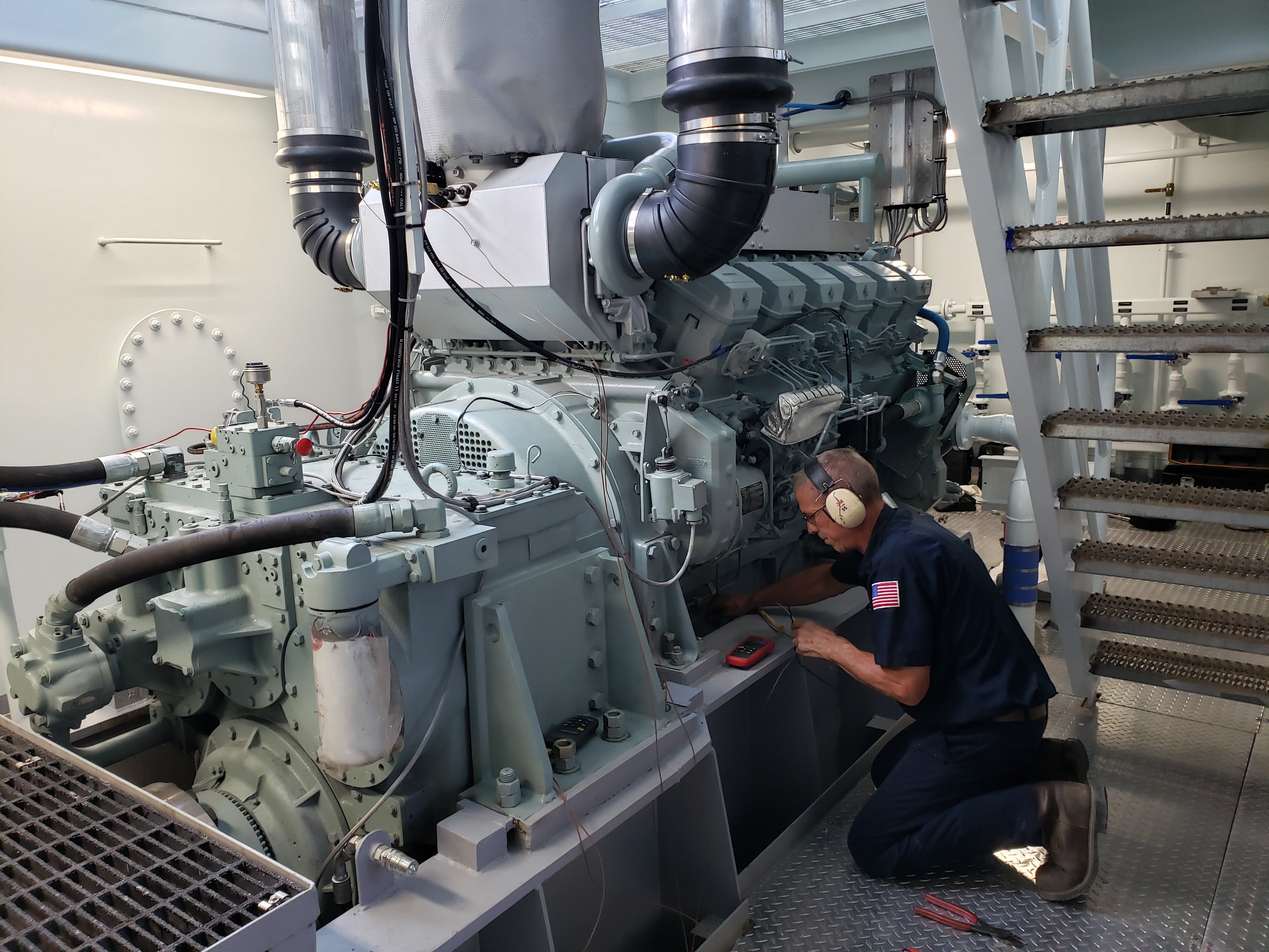 Diesel Technician working on a Mitsubishi Marine Engine
